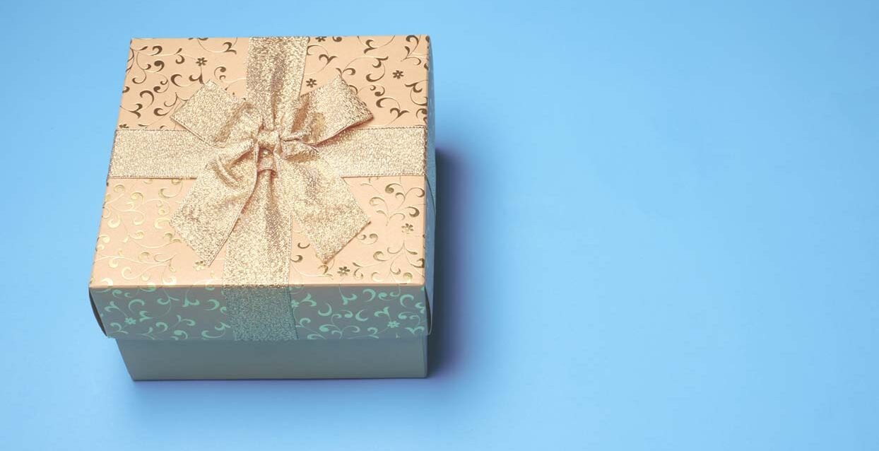 Top view of gift box on blue background. Free space for text Top view of gift box on blue background. Free space for text